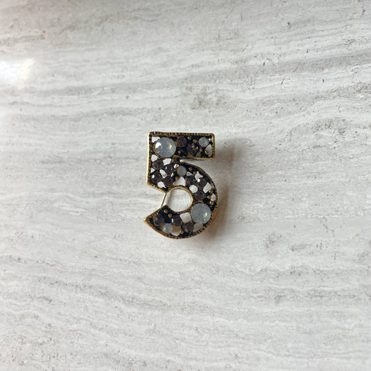 Number 5 broche