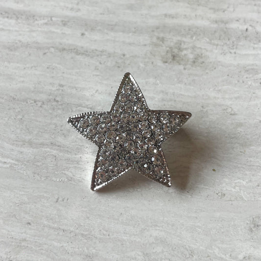 Glitterende ster broche