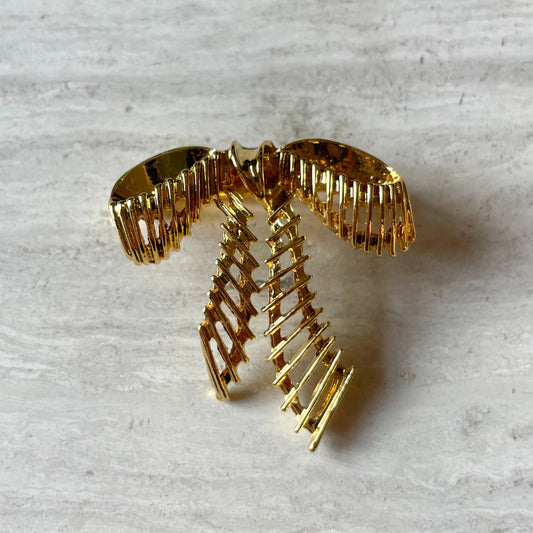 Gouden strik broche